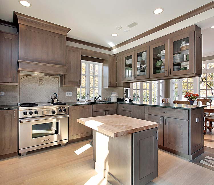 Rustic kitchen with wooden cabinets and a central island, highlighting kitchen remodeling in Cave Spring by MJ Painting & Renovations