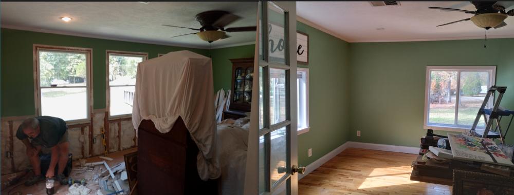 A bedroom with a bed and a ceiling fan, showcasing interior painting services in Cave Spring